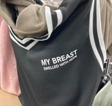 My breast swelled with hopeとロゴが入った洋服