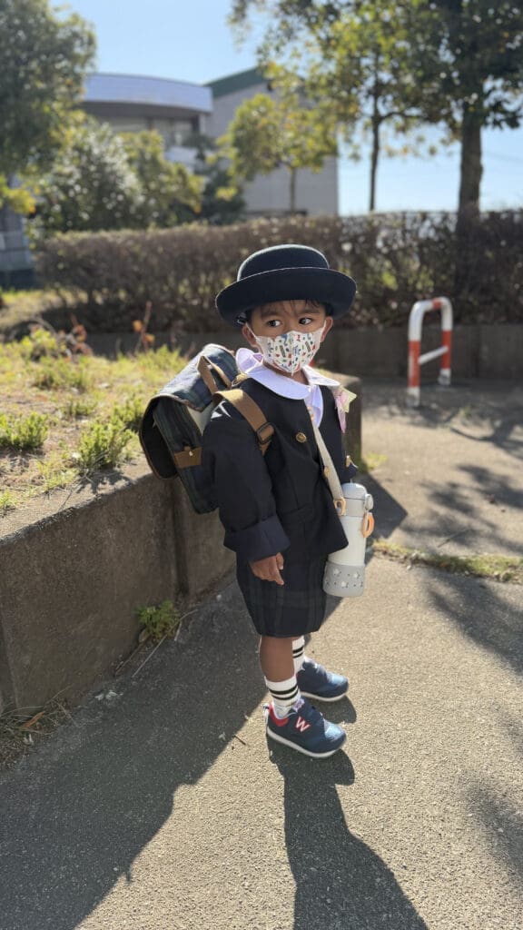 Izaan is eagerly waiting to ride the school bus for the very first time.
