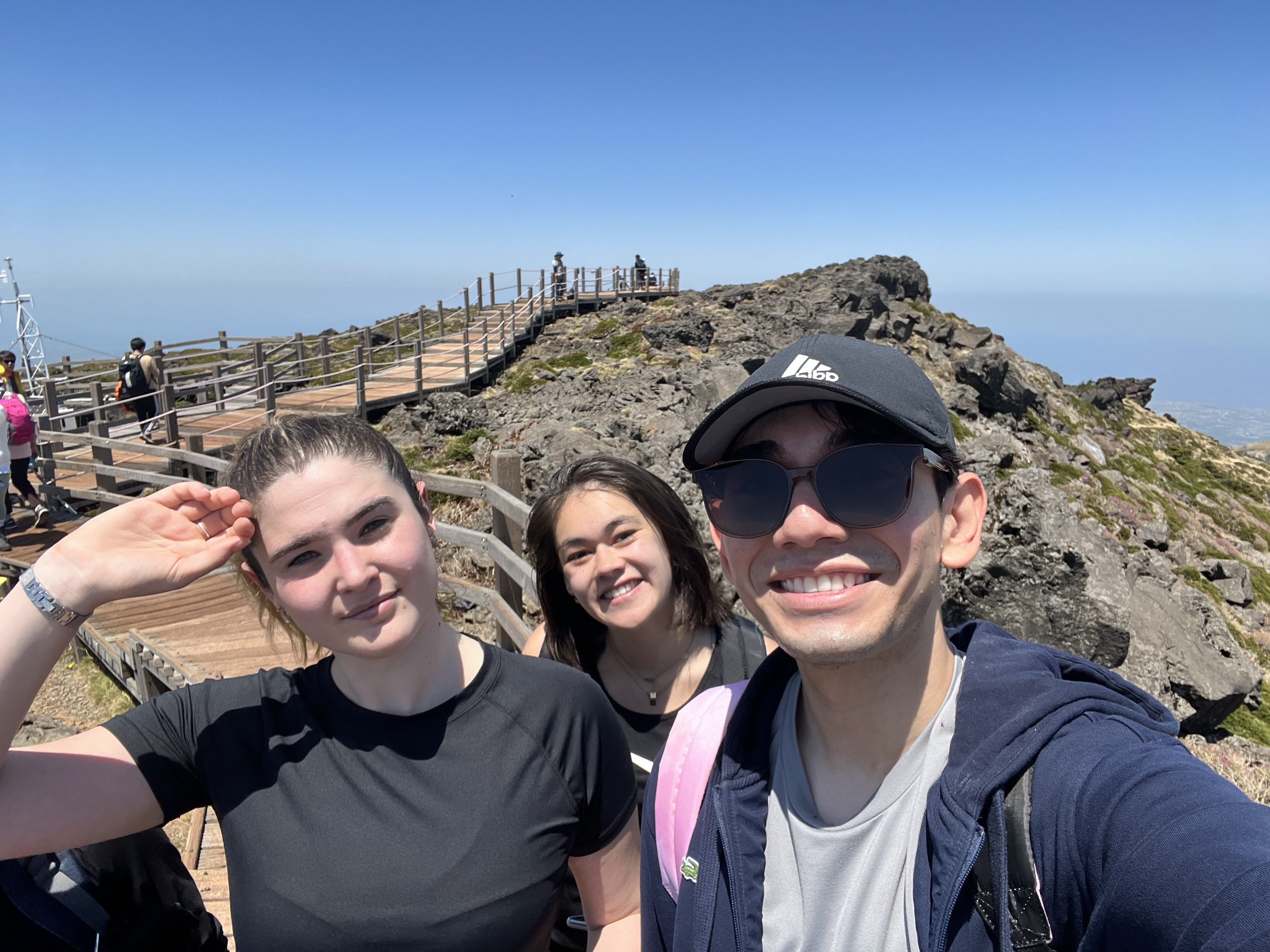 a picture of my friends and I after hiking 4 hours to get the the top of Mt. Hallasan