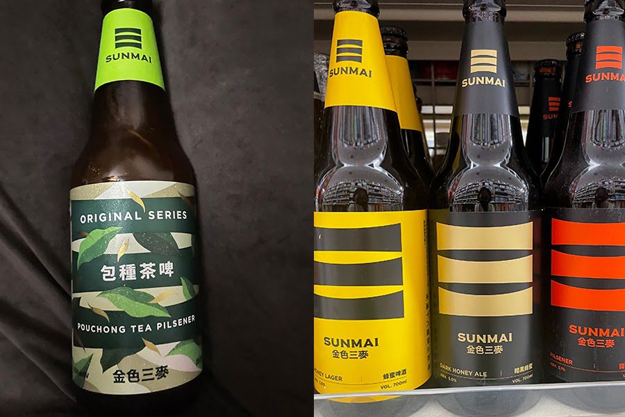 金色三麥（SUNMAI ）の瓶ビール。左側に緑のラベル、右側には黄色、ベージュ、赤基調のラベルの瓶。